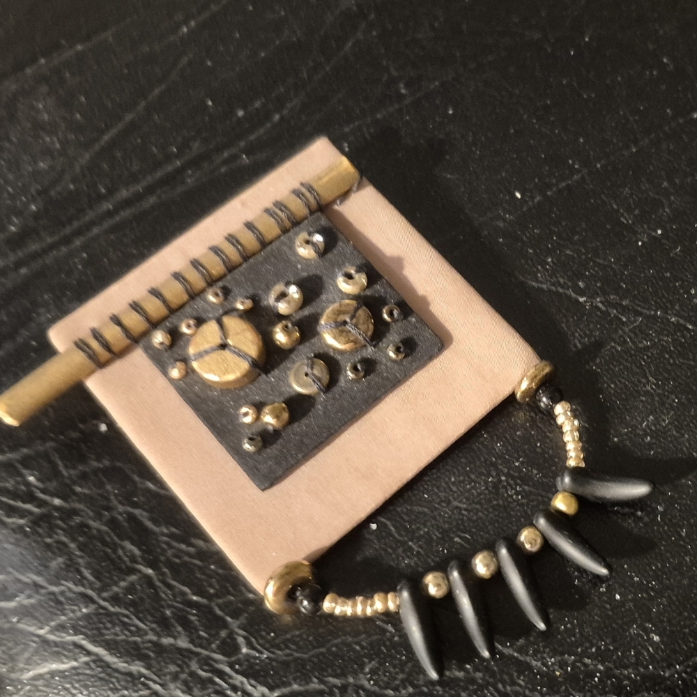 Artistic Black and Gold Pin